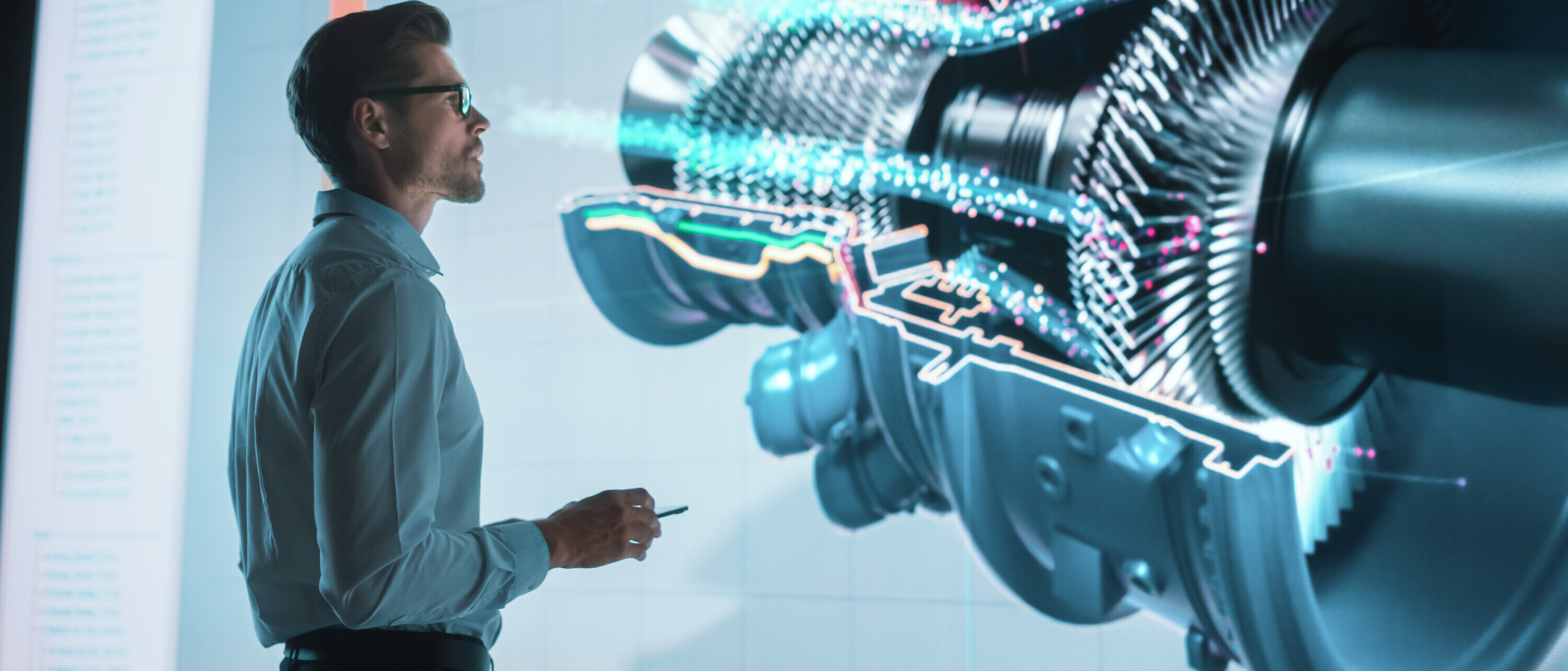 1355632629 Ingenieur vor einer Projektion einer Maschine