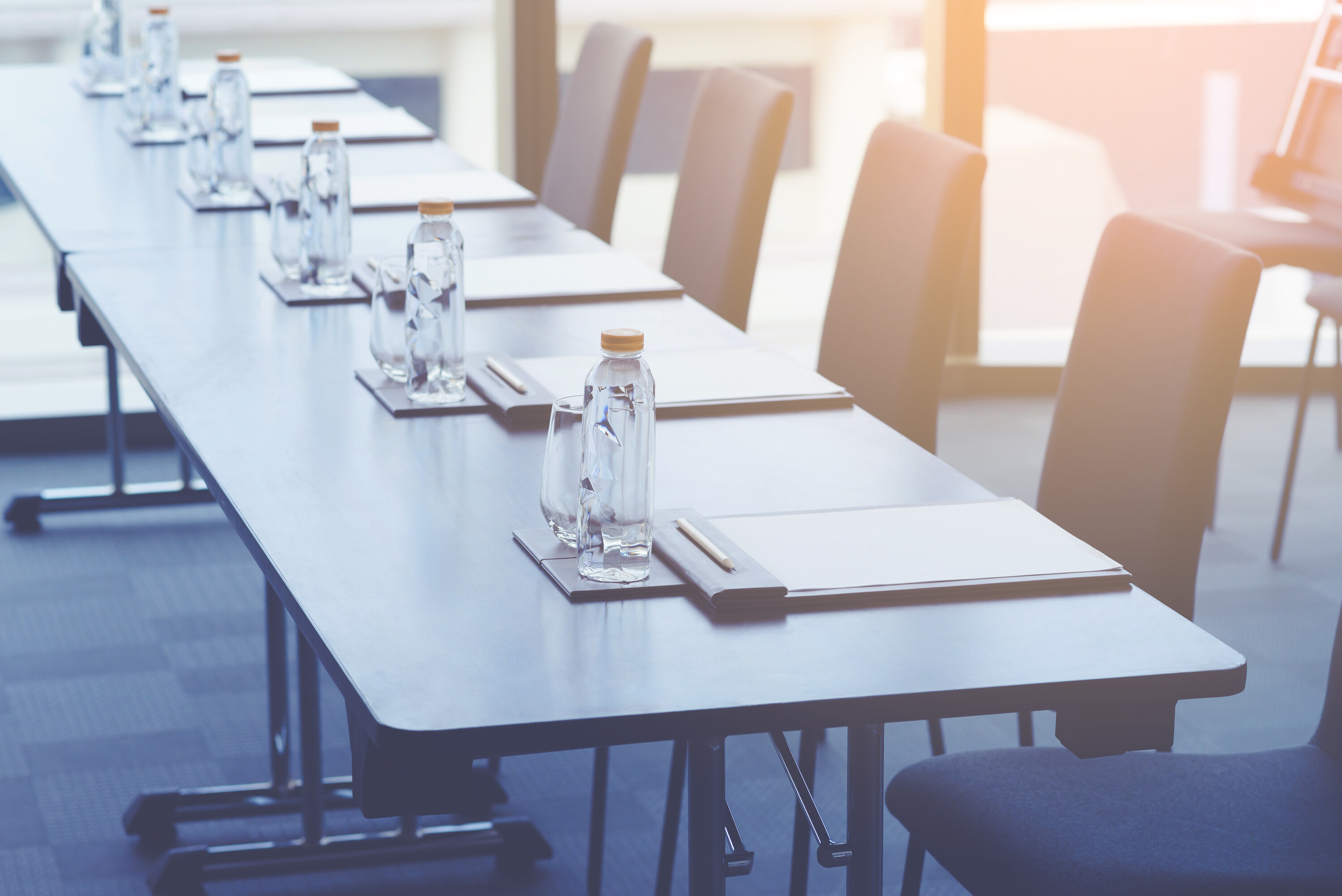 Plastic water bottles, Drinking glasses with pencil and white pa